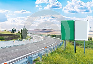 Two empty road signs near highway