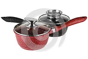 Two enameled dippers, red and black, with glass lids, on a white background