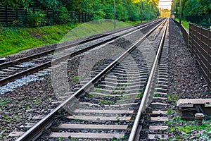 Two endlessly long train railroads with the tracks vanishing in the distance horizon amazing transportation or traveling backgroun