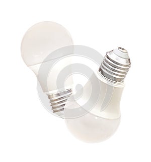 Two energy saving light bulbs with frosted glass isolated on white background