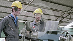 Two engineer man training work with laptop computer together in factory industrial.