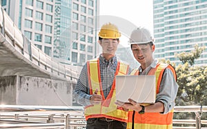 Two engineers discuss about the projects and construction site