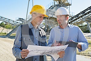 two engineers at industrial facility