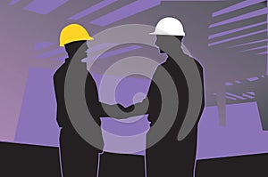 two engineers shaking hands