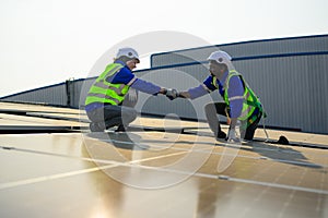 Two engineers technicians shacking hands together with successful project