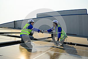 Two engineers technicians shacking hands together with successful project