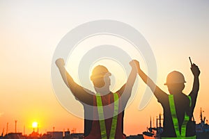 Two engineers and technicians work together.