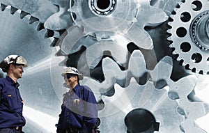 Engineers, workers with giant gear machinery photo