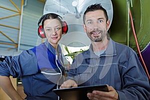 two engineers working on satellite dish