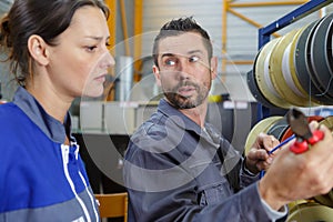 two engineers working together in factory