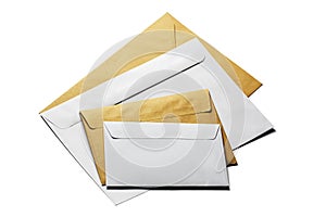 Two envelopes in white and kraft paper on isolated white background with shadows