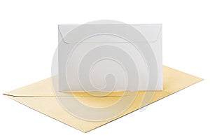 Two envelopes in white and kraft paper on isolated white background with shadows