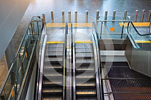 Two escalator stairs up and down to different floors of the building