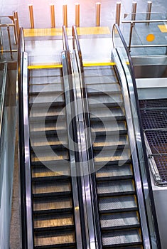 Two escalator stairs up and down to different floors of the building