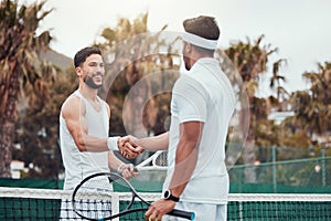 Two ethnic tennis players shaking hands before playing court game. Smiling athletes team standing and using hand gesture