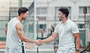 Two ethnic tennis players shaking hands before playing court game. Smiling athletes team standing and using hand gesture