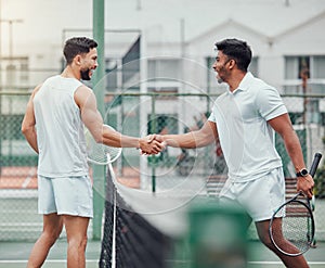 Two ethnic tennis players shaking hands before playing court game. Smiling athletes team standing and using hand gesture