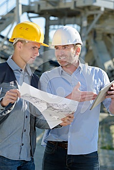 Two experts supervising construction