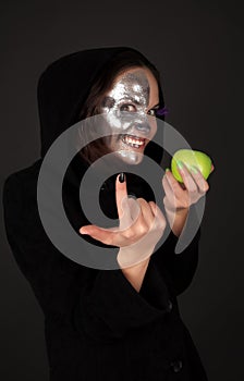 Two-faced sorceress with apple tempt photo