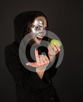 Two-faced sorceress with apple tempt photo