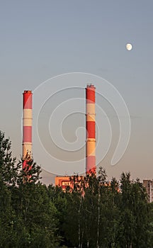 Two factory pipes and the moon