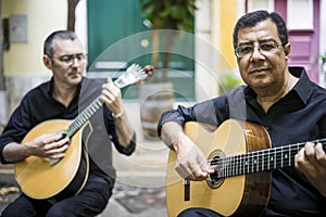 Two fado guitarists with acoustic and portuguese guitars