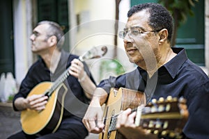 Two fado guitarists with acoustic and portuguese guitars