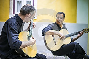 Two fado guitarists with acoustic and portuguese guitars