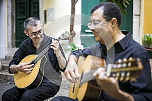 Two fado guitarists with acoustic and portuguese guitars