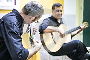 Two fado guitarists with acoustic and portuguese guitars