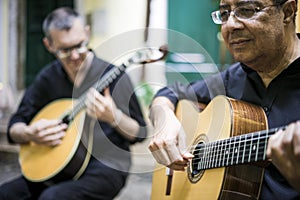 Two fado guitarists with acoustic and portuguese guitars