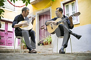 Two fado guitarists with acoustic and portuguese guitars