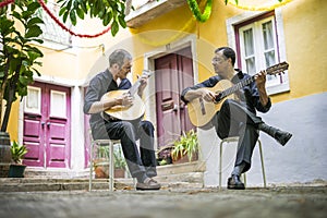 Two fado guitarists with acoustic and portuguese guitars