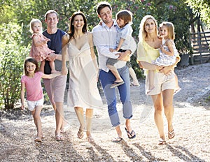 Two Families On Country Walk Together