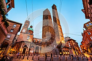 Two famous falling Bologna towers Asinelli and Garisenda. Evening view, long exposure. Bologna, Emilia-Romagna, Italy photo