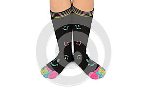 Two feet in happy socks with toes