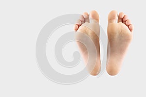 Two feet isolated on gray background with copy space