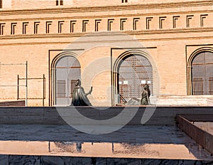 Two female bronze sculptures in Pilar Square, Zaragoza, Spain. Copy space for text.