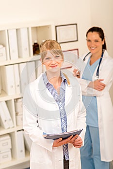 Two female doctor standing at medical office