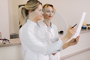 Two female doctors are looking at the results of the medical tests