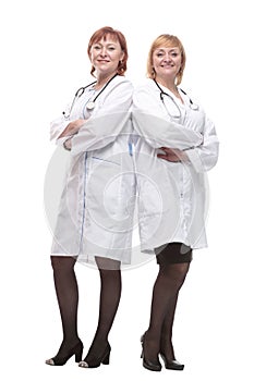 two female doctors with stethoscopes standing together.