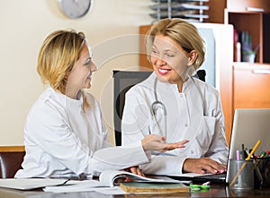 Two female doctors working together.