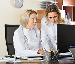 Two female doctors working together