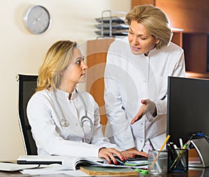 Two female doctors working together