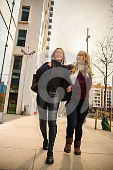Two Female Friends Having Fun Laughing and Shopping in the City