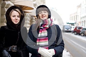 Two female friends walking outdoor