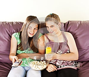 Two female friends watching televison photo