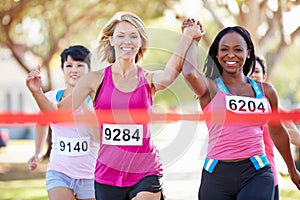 Two Female Runners Finishing Race Together