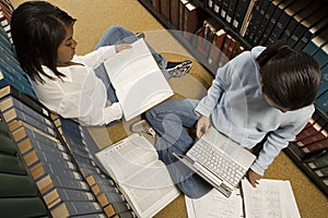 Two female students studying in the library
