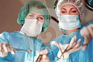 Two female surgeons operate in the hospital